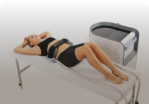 Woman with BTL Emsculpt Neo applicators on the abdomen