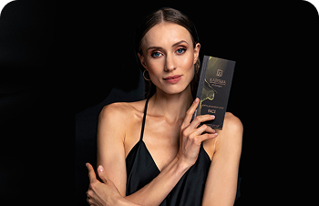 Karisma – woman in a black dress holding a Karisma box