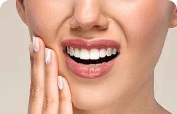 Bruxism treatment – woman with her hands on her jaw